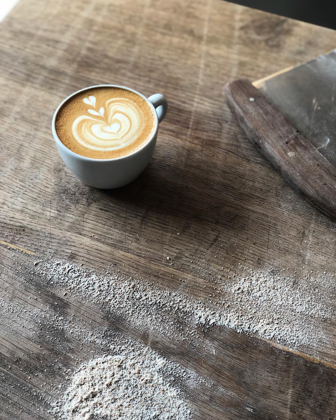 a cup of coffe on bread board